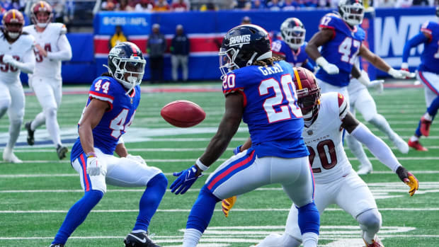 Oct 22, 2023; East Rutherford, New Jersey, USA; New York Giants running back Eric Gray (20) misses the punt in the first half against the Washington Commanders at MetLife Stadium.